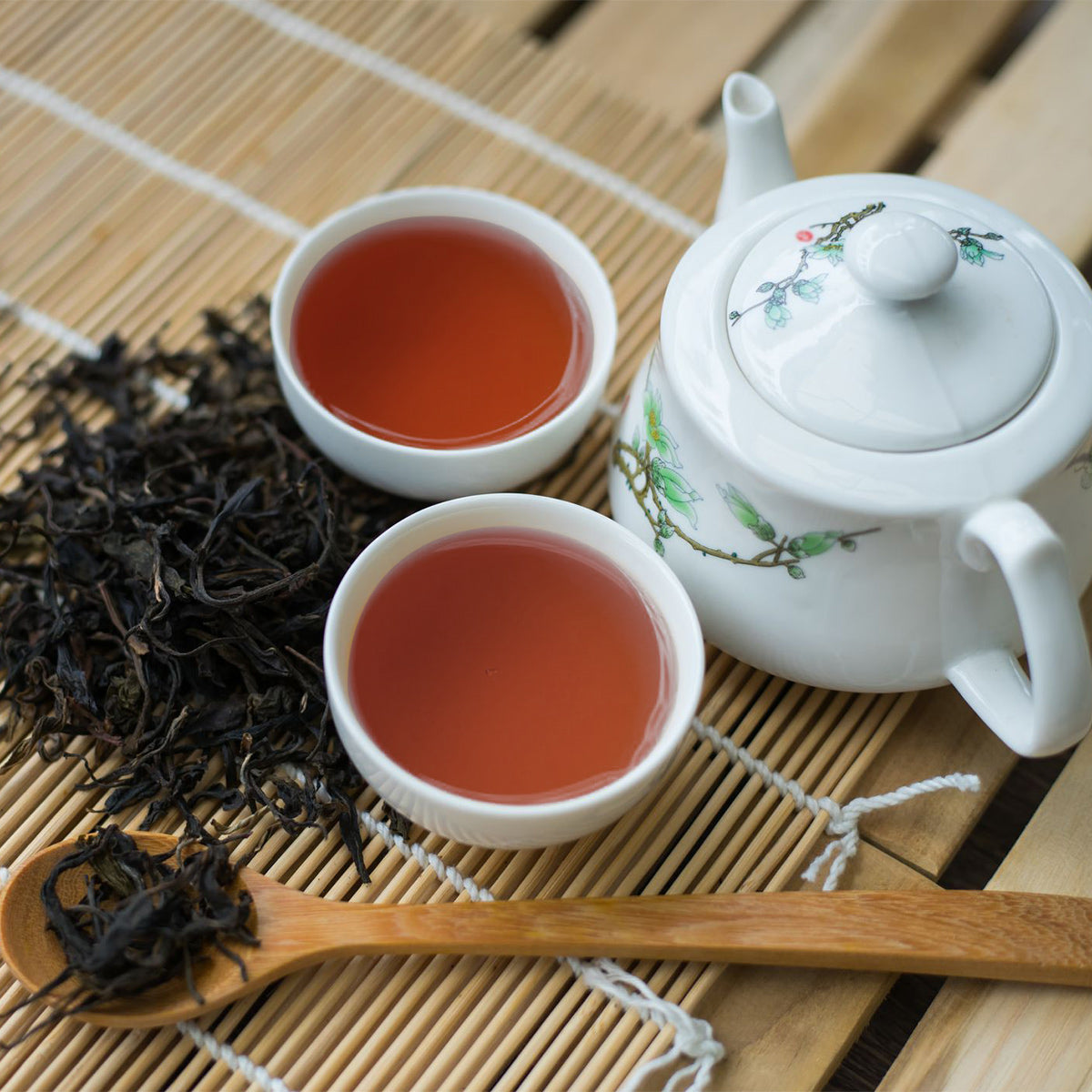 Chinese style tea set with FBOP Loose Black 7 oz Ceylon Tea and a wooden spoon